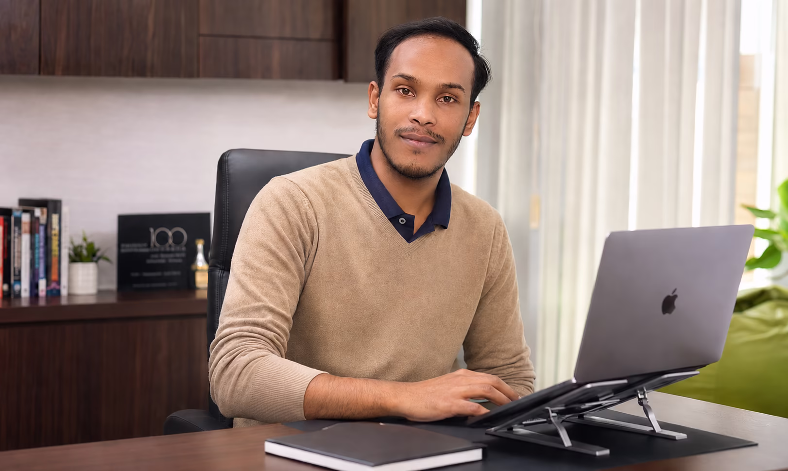 Product designer Masud Rahaman focused on branding and UI design
